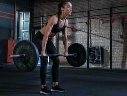 Woman doing a deadlift workout 