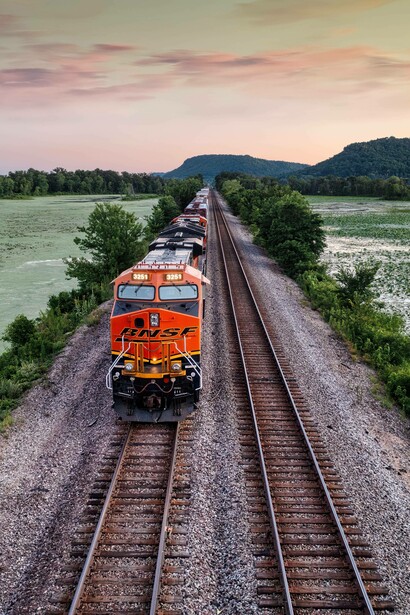 Train passes by fields
