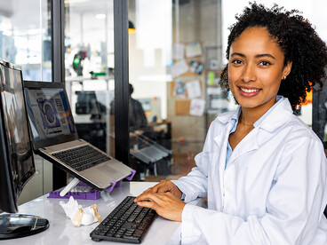 Dental specialist designing a 3D dental model using advanced AI-assisted healthcare software