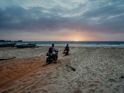 People on motorbikes on the beach 