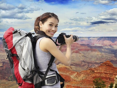 A traveler taking a picture of a unique landscape