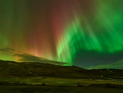 Spectacular northern lights display over Reykjahlíð, Þingeyjarsveit, Iceland