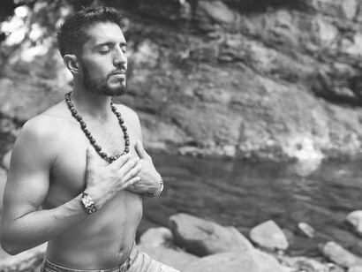 Man meditating in nature, the law of integration and the spiritual being