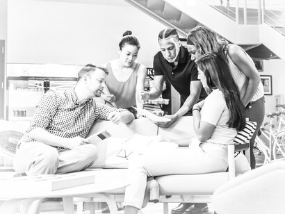 A business team collaborating together and communicating about the work
