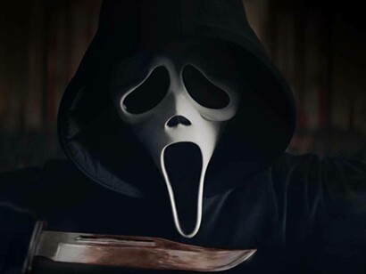 Ghost Face wielding a bloodied knife from the film Scream