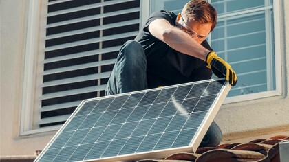 Man installing solar panel