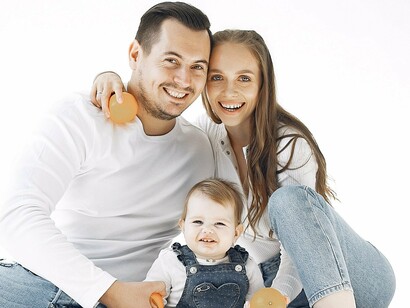 A young couple with a kid, what used to be considered a stereotypical family but is less and less popular with each year