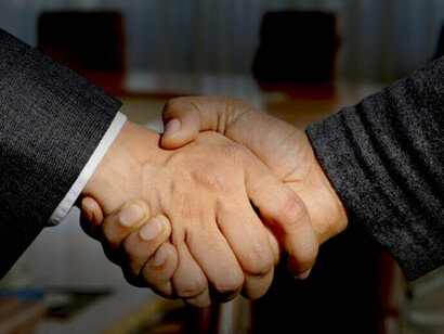 Handshakes symbolize the close of a deal after a lobbying interaction