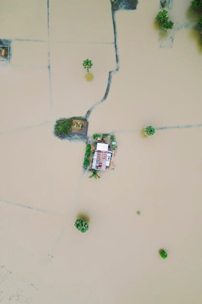 Flooded building in Kijal, Terengganu, Malaysia, as a result of extreme weather events and rising water levels