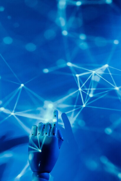 Pointing blue robotic hand 