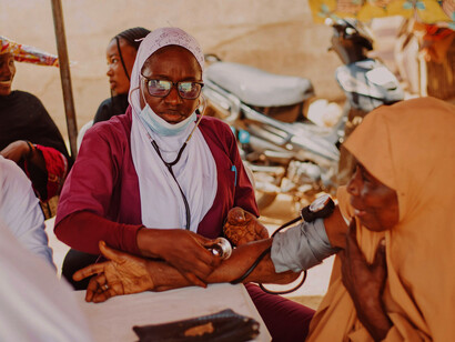 A community health check-up in Kaduna, Nigeria, reflecting disparities in healthcare access and resource availability