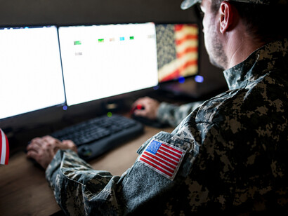 American soldiers analyzing intelligence and coordinating activities from a command center