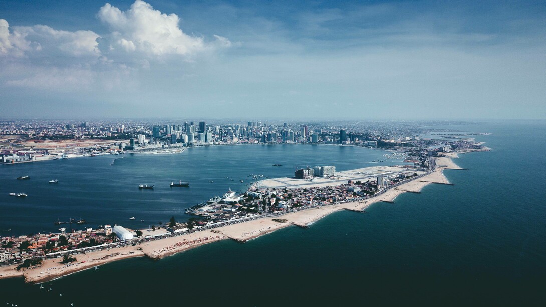 An aerial photo of buildings near the coast of Luanda, Angola