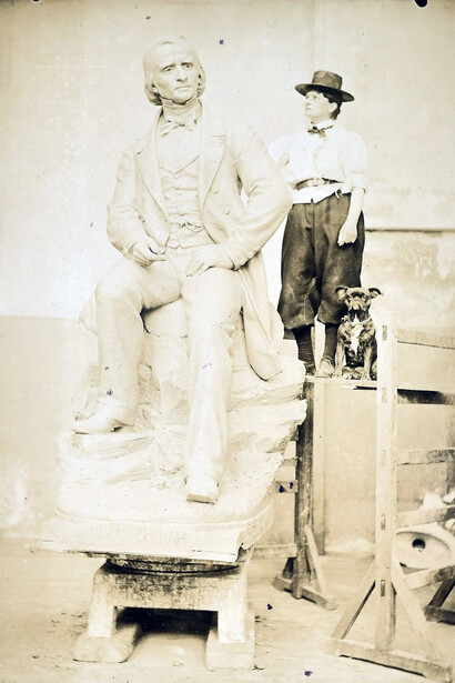 Ambrosia Tønnesen posing in the studio with a model of the J.C. Dahl monument. Courtesy of Kode Museums. Photo by Synnøve des Bouvrie