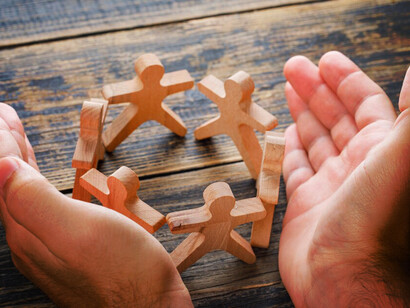 Symbolizing unity and togetherness, the wooden figures of people holding hands embody the spirit of human rights activism, civil society organizations, and the ongoing struggle for social justice