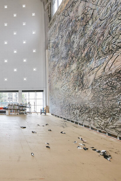Julie Mehretu at work; courtesy the artist and Marian Goodman Gallery; © Julie Mehretu; photo: Tom Powel Imaging, Inc.