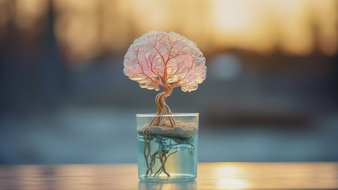 A delicate, glowing brain-like tree with roots in a clear glass of water symbolizes the profound shift towards cultivating inner growth and cognitive optimization as the new ultimate luxury