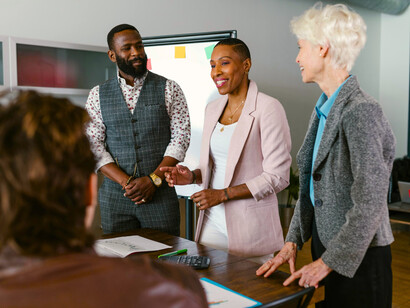 A team sharing a concept in a meeting room, reflecting the shift toward sustainable growth