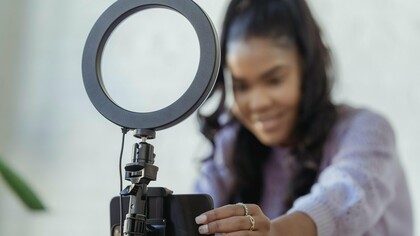 A content creator making sure the angle is just perfect to maximize engagement