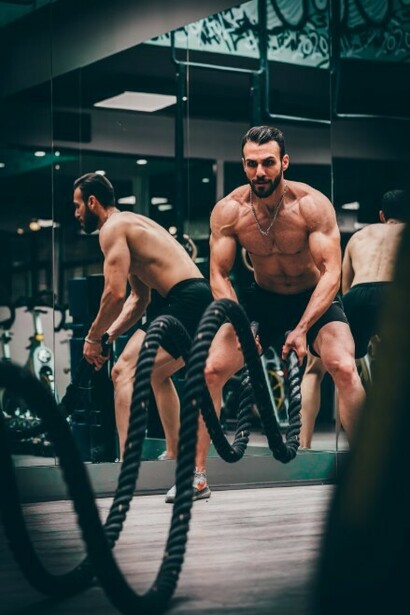Images of muscular men and fitness influencers often reflect the societal pressure for six-pack abs, contributing to rising concerns around male body dysmorphia
