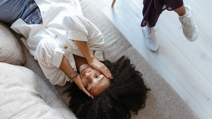 A woman feeling overwhelmed, which is a normal part of the journey in therapy