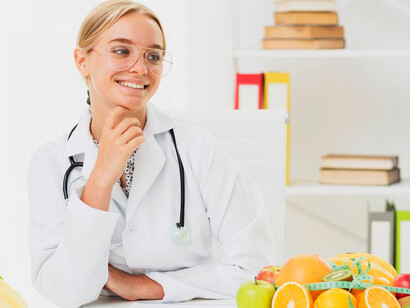 A female scientist exploring the link between healthy food, DNA strands, and the impact of nutrition on genetic code