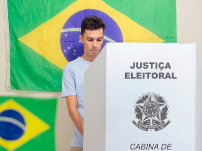 A Brazilian voter participates in the national elections at a local polling station