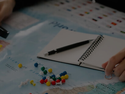 Person looking at marked countries on map