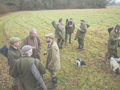 Hunters in the English countryside wearing tweed