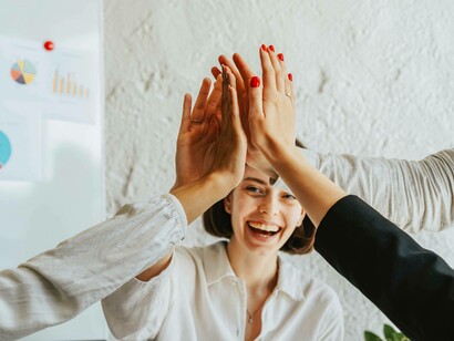 Working together, and showing support for each other's accomplishments and successes