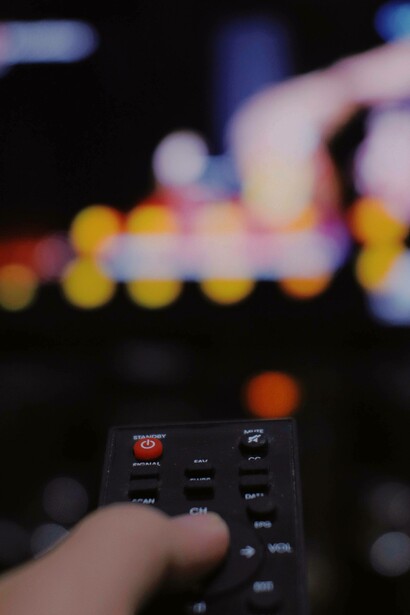 Tv remote and blurred screen tv