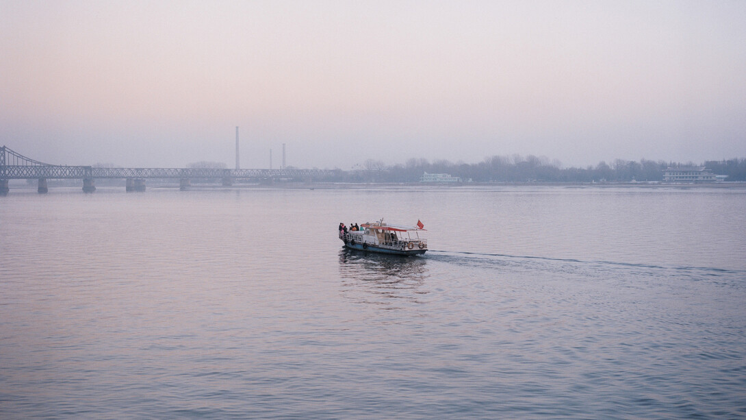 Tomoko Yoneda, from the series Scene, Wedding - View of the wedding party on the river that divides North Korea and China, Dandong, China 2007 © Tomoko Yoneda