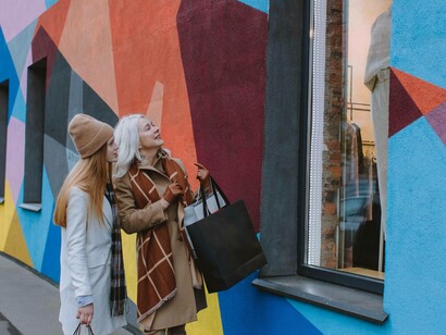 Granddaughter and grandmother window-shopping