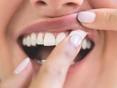 The essence of a woman engaged in moist nicotine tobacco snus consumption, reflecting the tactile experience and potential allure of this form of tobacco use