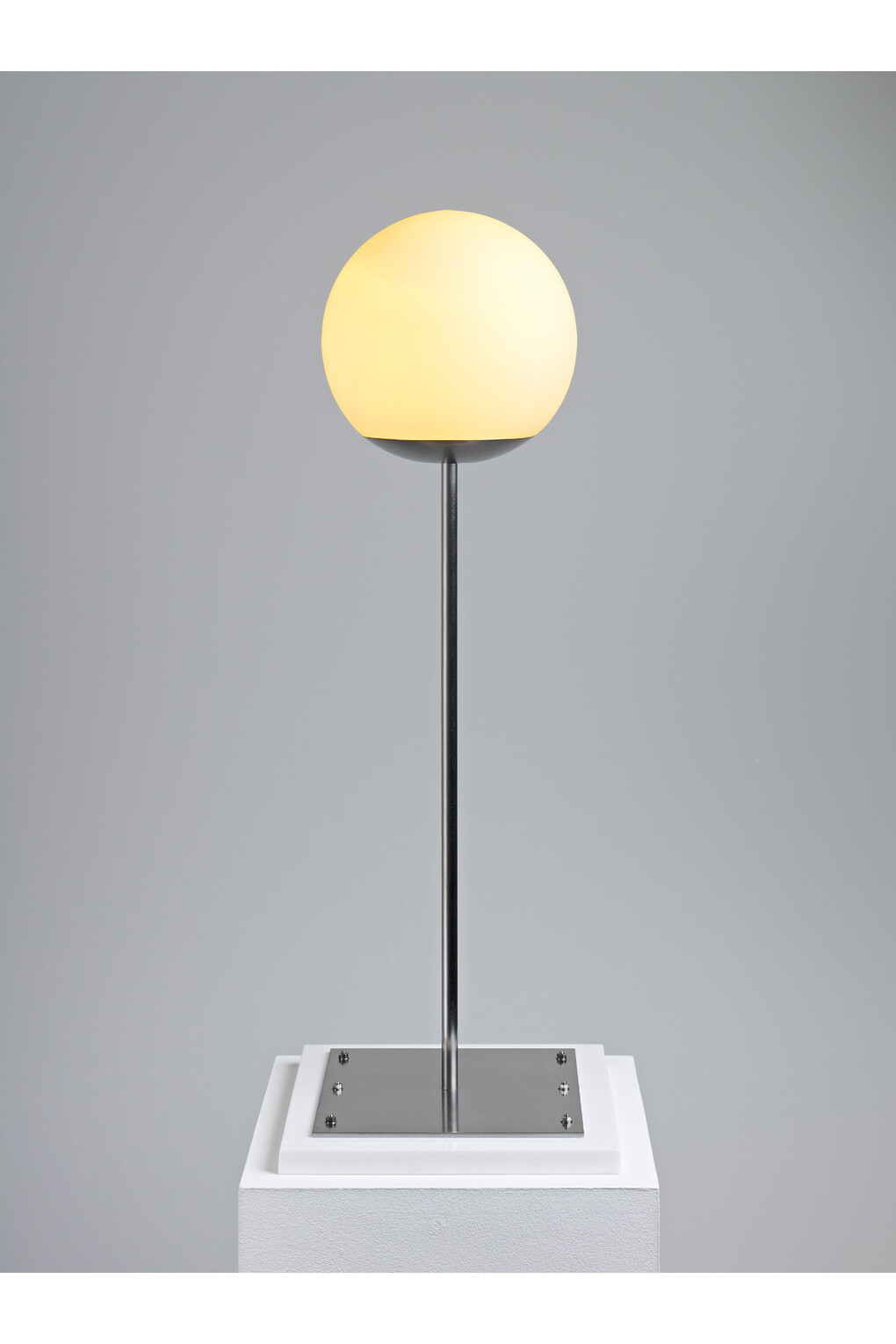 Piero Golia, Clone (Untitled), 2011, Stainless steel, glass, marble and light, 28 x 9 7/8 x 9 7/8 inches  (71.1 x 25.1 x 25.1 cm), Artist Proof 1/2, ©Piero Golia. Courtesy of the artist and Gagosian Gallery.
