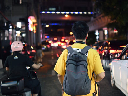 The streets of Shenzhen come alive at night with people bustling through the city’s vibrant atmosphere