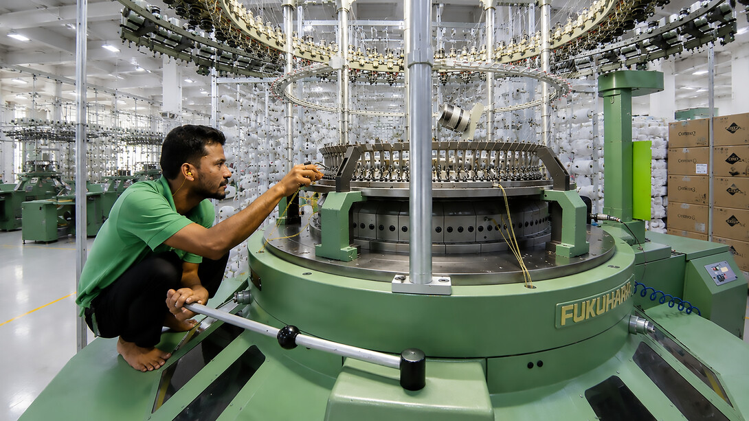 A skilled garment worker carries out specialised production tasks at a clothing factory in Bangladesh, photo by International Labour Organization 