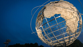 Captivating low-angle photograph of a metallic Earth-themed statue, New York, USA