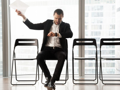 An unemployed expat waiting for a job interview, facing the challenges of starting a new life abroad