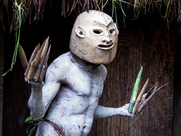 With a mask moulded from river clay and adorned with natural pigments, an Asaro Mudman performs a dance of resilience and cultural continuity