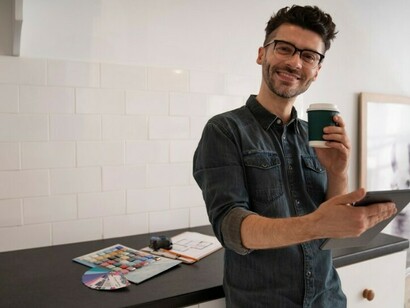 Man confidently working on a project, embracing daily learning and growth