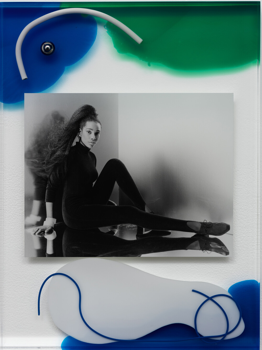 Elad Lassry, Untitled (Woman), 2015. Acrylic glass, silver gelatin print, wire, steel ball, pigment, 23 1/8 x 17 1/4 x 1 5/8 inches