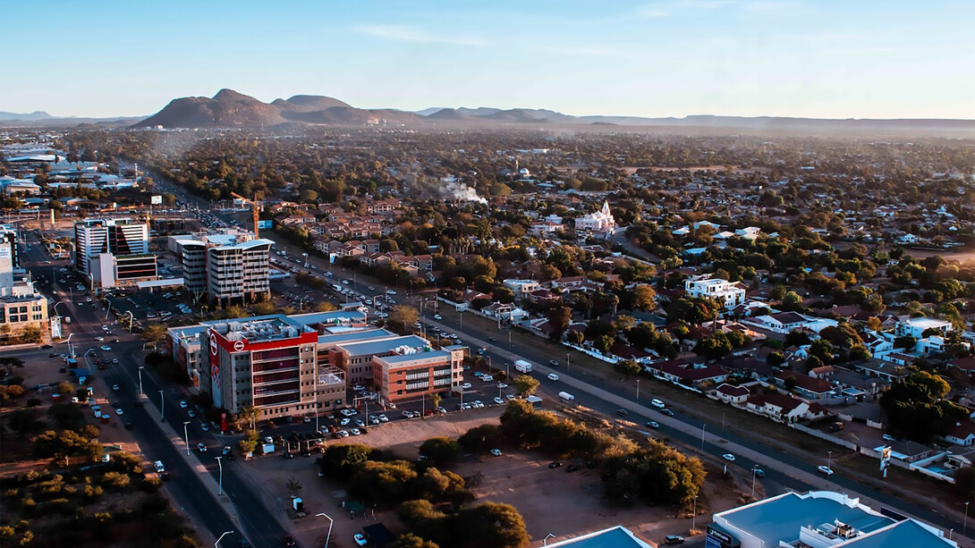 Gaborone, Botswana, a landlocked nation in Southern Africa, features a diverse landscape shaped by the Kalahari Desert and the Okavango Delta, which transforms into a vibrant animal habitat during the seasonal floods