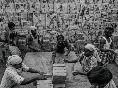 In the sweltering heat, labourers in India toil for minimum wage, their sweat a testament to their struggle for survival