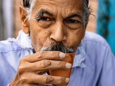 Portrait of an elderly man drinking traditional chai in Jaipur, India