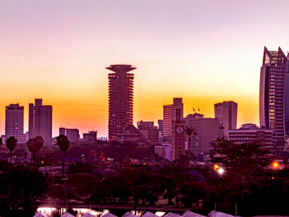 The Johannesburg skyline bathed in the warm hues of the evening sun, highlighting the city’s business district, South Africa