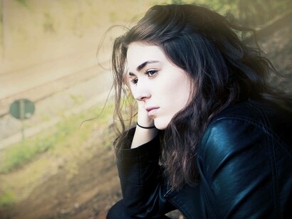 A woman contemplating her options as she has just discovered she has ADHD