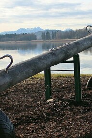 A seesaw waiting to be ridden and staring out into the vastness of the sea