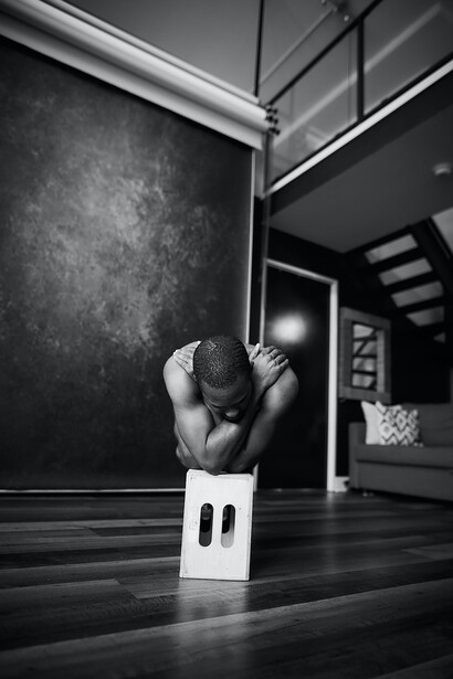 Amidst a grayscale setting, emanating a mesmerizing fusion of beauty, strength, and vulnerability