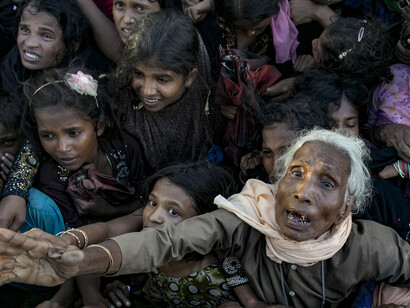 An old Rohingya woman and children